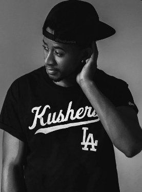 Person wearing a black Kushers Los Angeles tee
